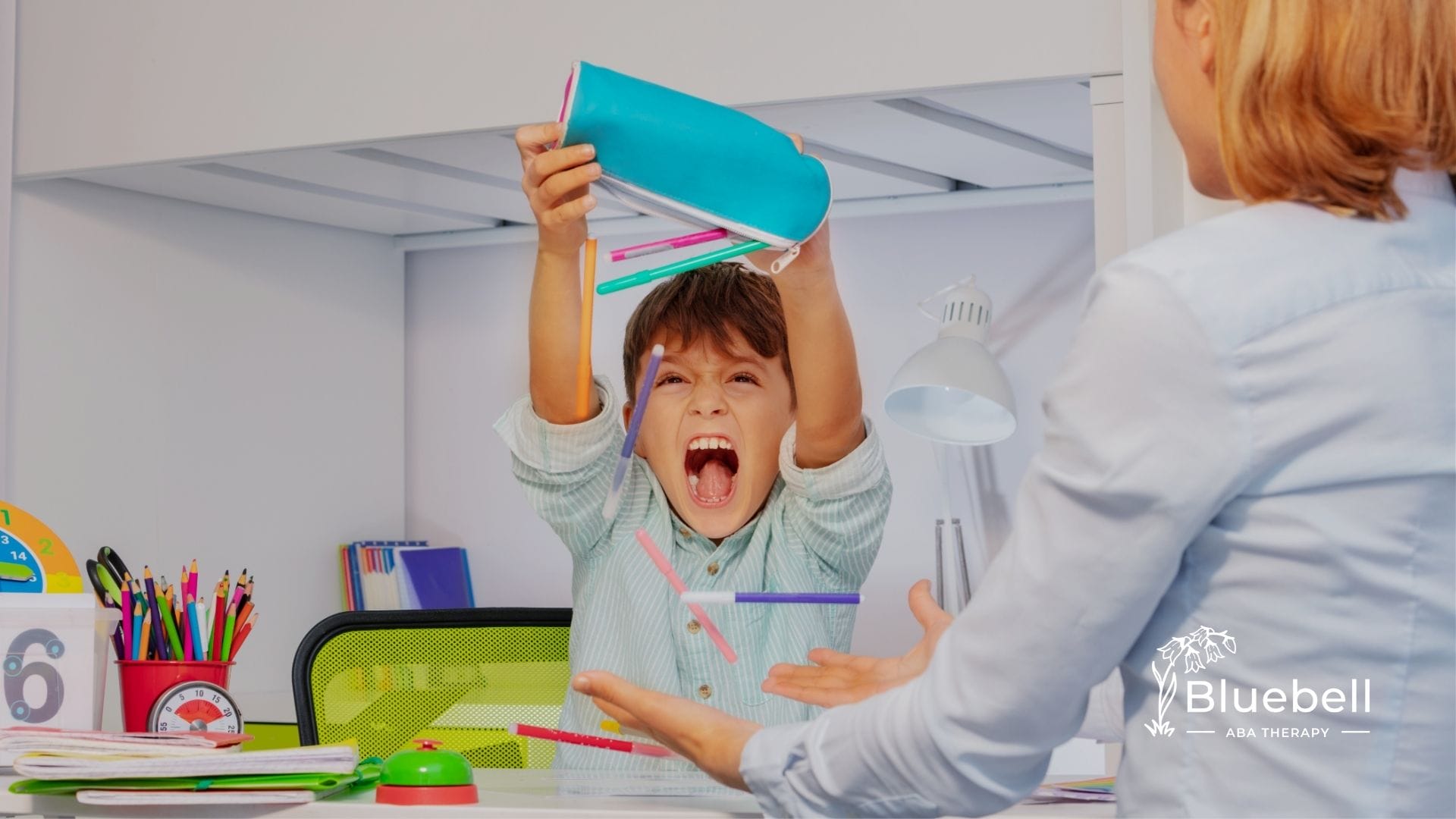 a child with his teacher on aba theraphy session