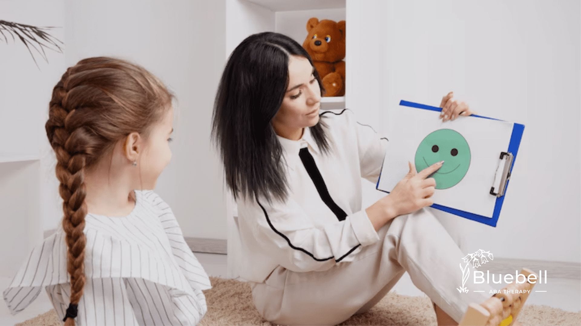 An RBT and a little girl during their ABA therapy session