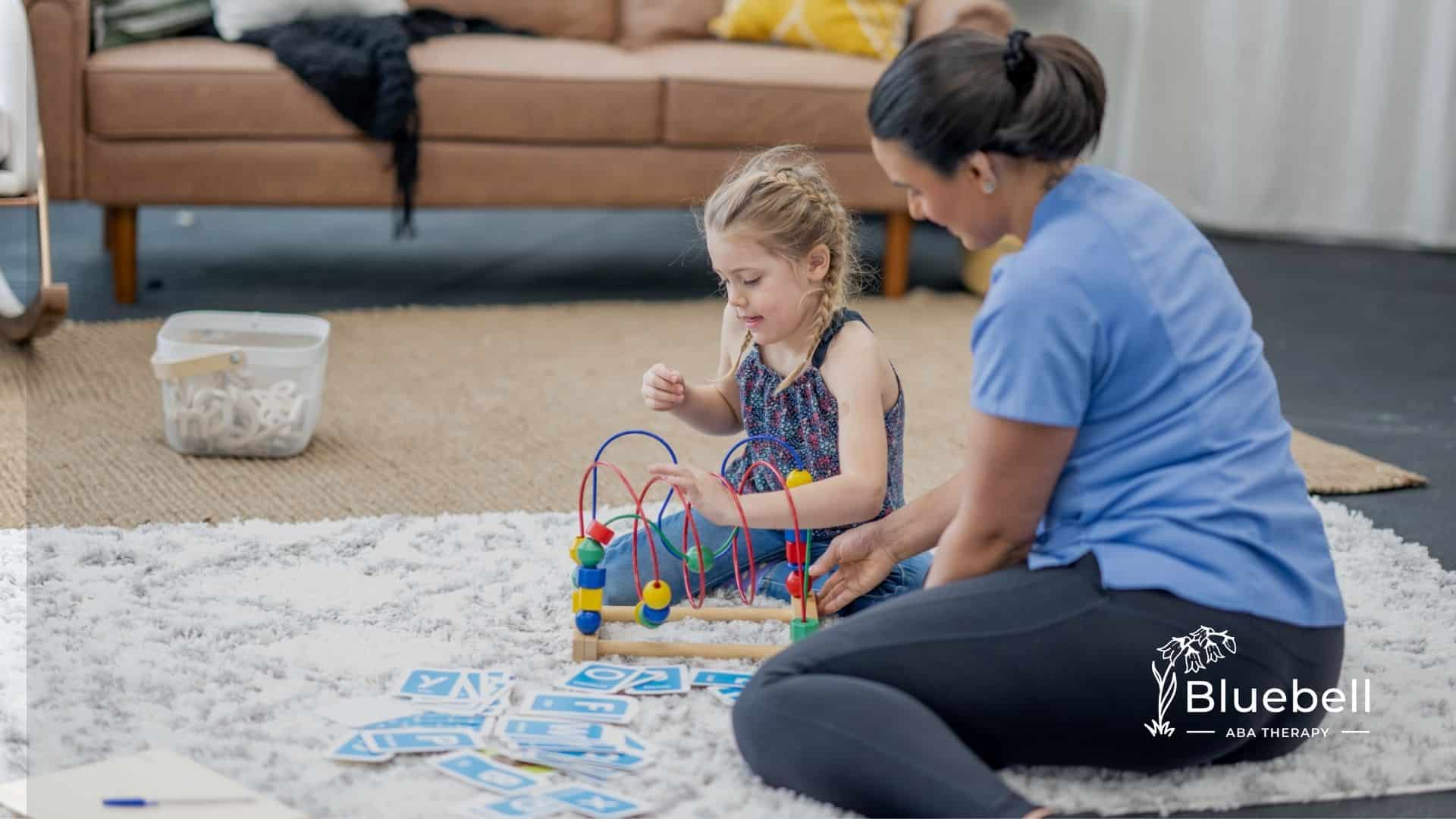 A little girl with her ABA Therapist.
