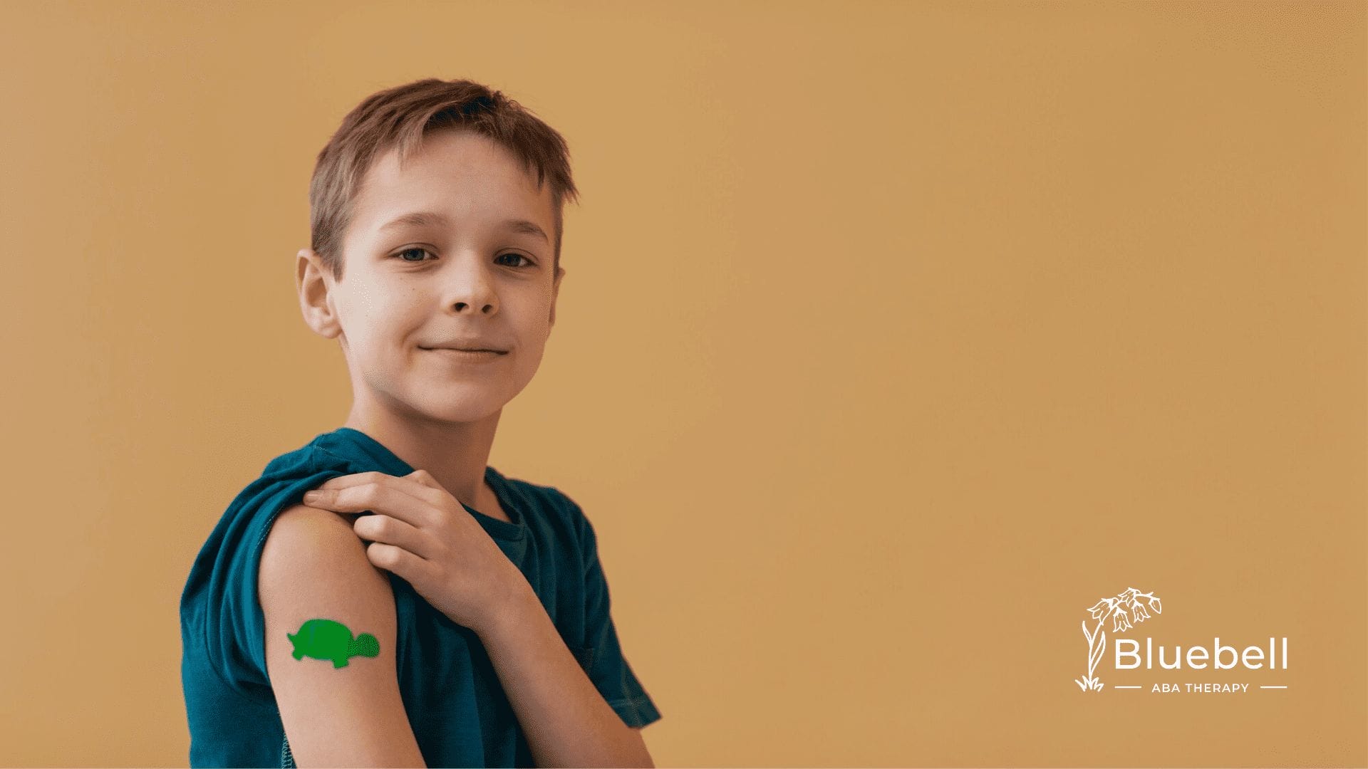 A boy showing his arm with bandage