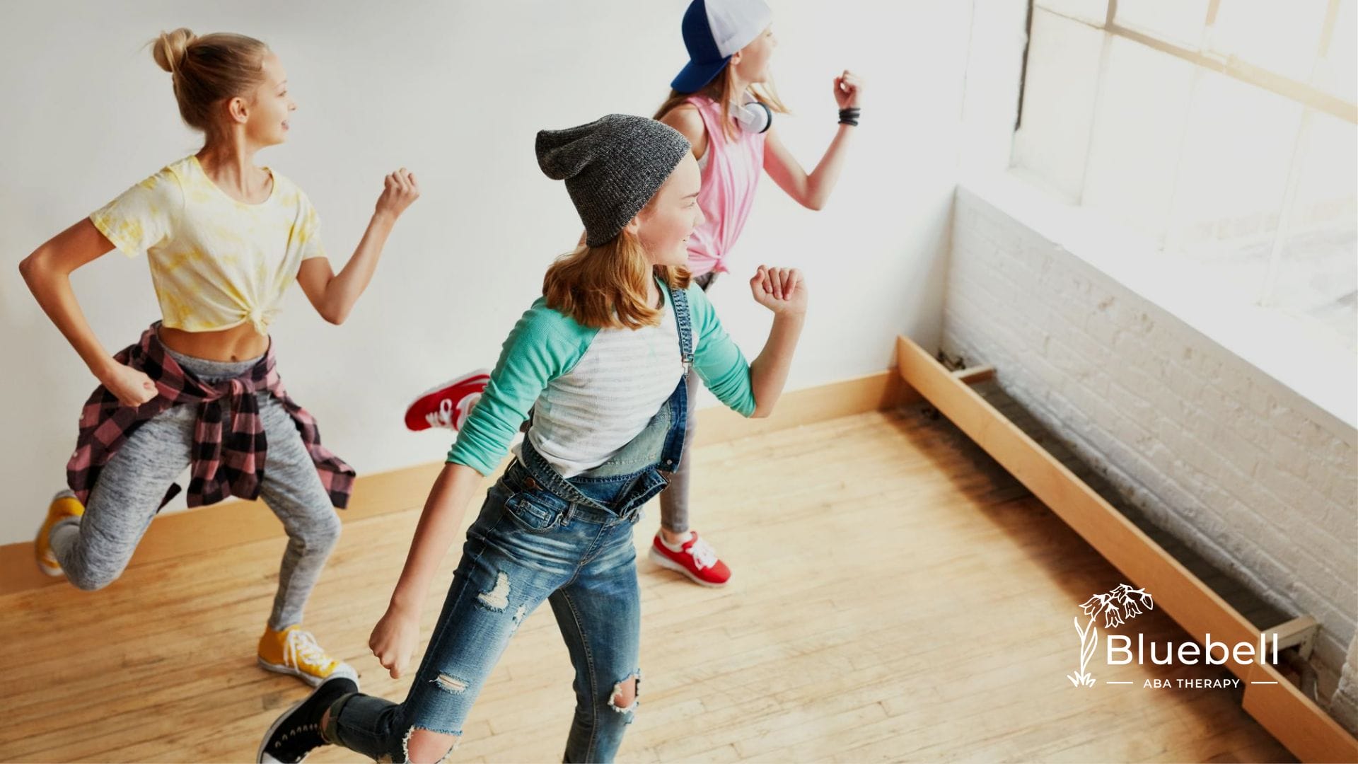 A group of kids dancing in a room